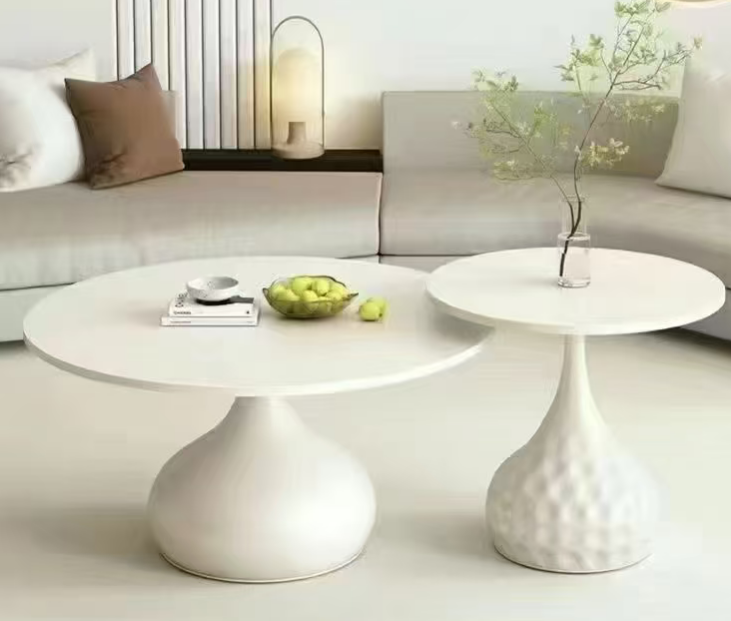 White round nesting coffee table set in a modern living room